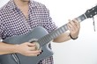 Young male playing acoustic guitar - isolated