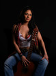 Beautiful latino rock chick with an acoustic guitar