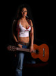 latino rock chick with a guitar and a cigarette in her mouth