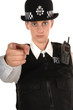Uniformed Female UK Police Officer pointing finger Uniformed Female UK Police Officer pointing finger