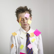 Boy covered with sticky notes Boy covered with sticky notes