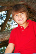 Boy climbing a tree