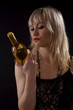 Photo: Woman with bottle of wine Woman with bottle of wine