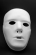 A white mask on a black background