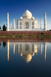 Taj Mahal reflected in river at twilight