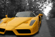 Yellow Super Car on a black and white road background Yellow Super Car on a black and white road background