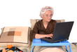 businesswoman in bed, working