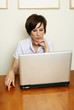 Winan looks at the laptop Winan looks at the laptop