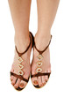 Woman's well-groomed feet in beautiful toeless shoes 
