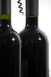 close-up of a screwdriver and red wine bottles