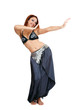 Pretty smiling bellydancer in costume dancing gracefully