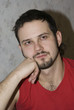 Young man face in the red t-short Young man face in the red t-short