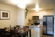 Staged dining room and kitchen Staged dining room and kitchen