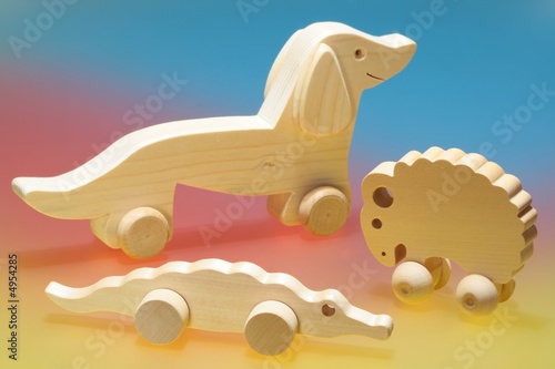 Photo: Wooden toys on colorful background Wooden toys on colorful background