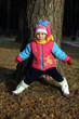 Girl dressed in warm clothing playinng