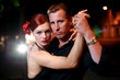 Foto: Couple dancing on a street at night. Couple dancing on a street at night.