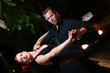 Couple dancing on a street at night. Couple dancing on a street at night.