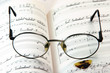 spectacles on book