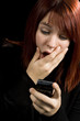 Girl amazed after checking her mobile phone