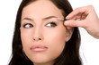 Model receives eyeshadow from make-up artist