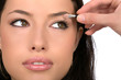 Pretty girl receives eyeshadow from make-up artist Pretty girl receives eyeshadow from make-up artist