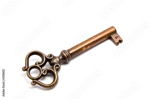 Photo: Antique key isolated on white Antique key isolated on white