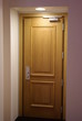 Wooden door with a light Wooden door with a light