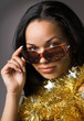 woman with sunglasses and gold glitter