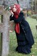 Gothic girl with a rose on a cemetery Gothic girl with a rose on a cemetery
