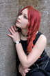 Gothic girl on a cemetery in sorrow