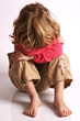 Little girl alone, afraid, hiding, feeling sad