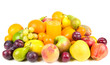 Pile of fruits around the glass of fruit juice isolated on white