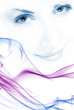 Beutiful girl's face toned in blue with abstract colorful smoke