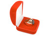 Golden ring in red box.