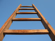 wooden stair standing over blue sky