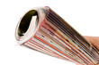Roll of magazine in hand