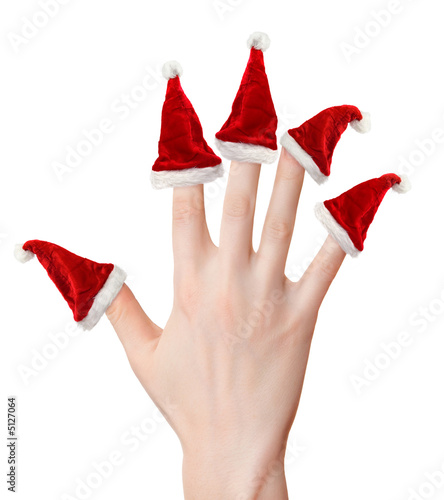 Photo: Woman hand with santa hats Woman hand with santa hats