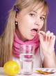 woman takes a pill