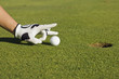 putting golf ball by hand putting golf ball by hand
