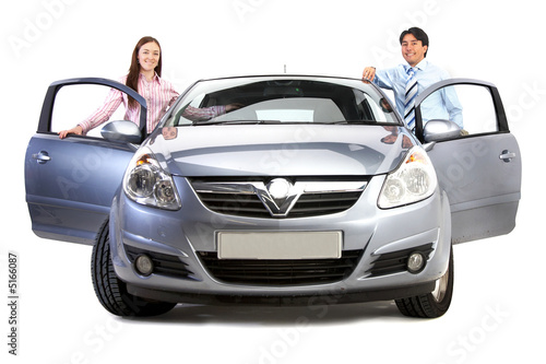 happy couple with new car