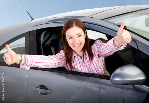 woman happy with her new car