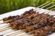 chicken satay skewer close up perspective