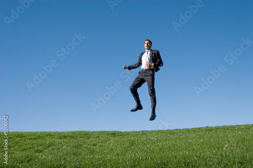 Businessman jumping