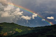 rainbow by the mountain over evening sky