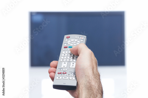 Hand with remote control and flat tv Hand with remote control and flat tv