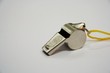 Metal whistle with the yellow cord
