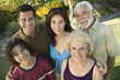 Boy 13-15 with parents and grandparents, outside, elevated view portrait.