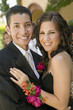 Photo: Well-dressed teenage couple embracing outside school dance, portrait Well-dressed teenage couple embracing outside school dance, portrait