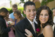 Photo: Well-dressed teenage couple embracing outside school dance Well-dressed teenage couple embracing outside school dance