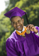 Graduate Holding Medal outside, portrait